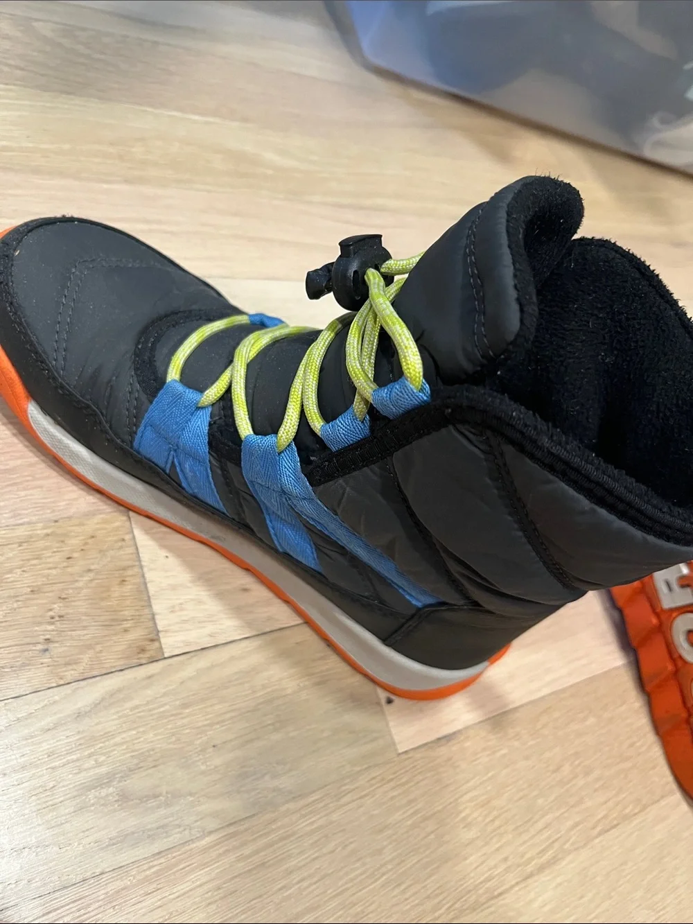 Sorel Kids Black Boots with Blue Stripes and Orange Sole